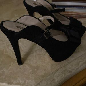 Fabiola black suede pumps with strap.
